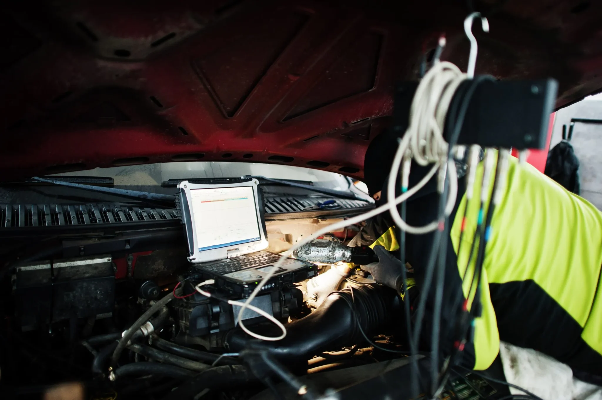 Mechanic performing car diagnostic repair in Singapore