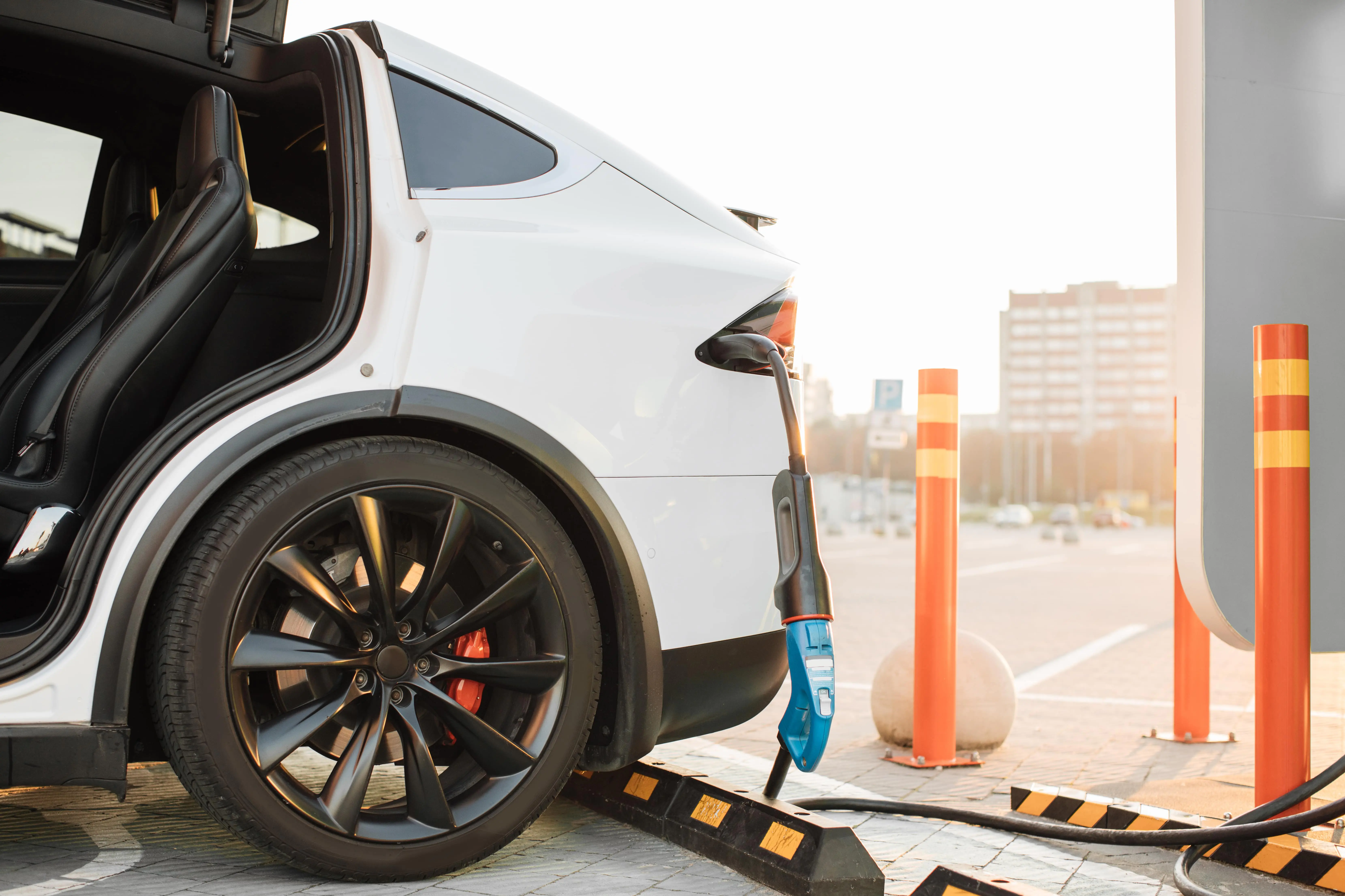 Mechanic using laptop for car engine diagnostics